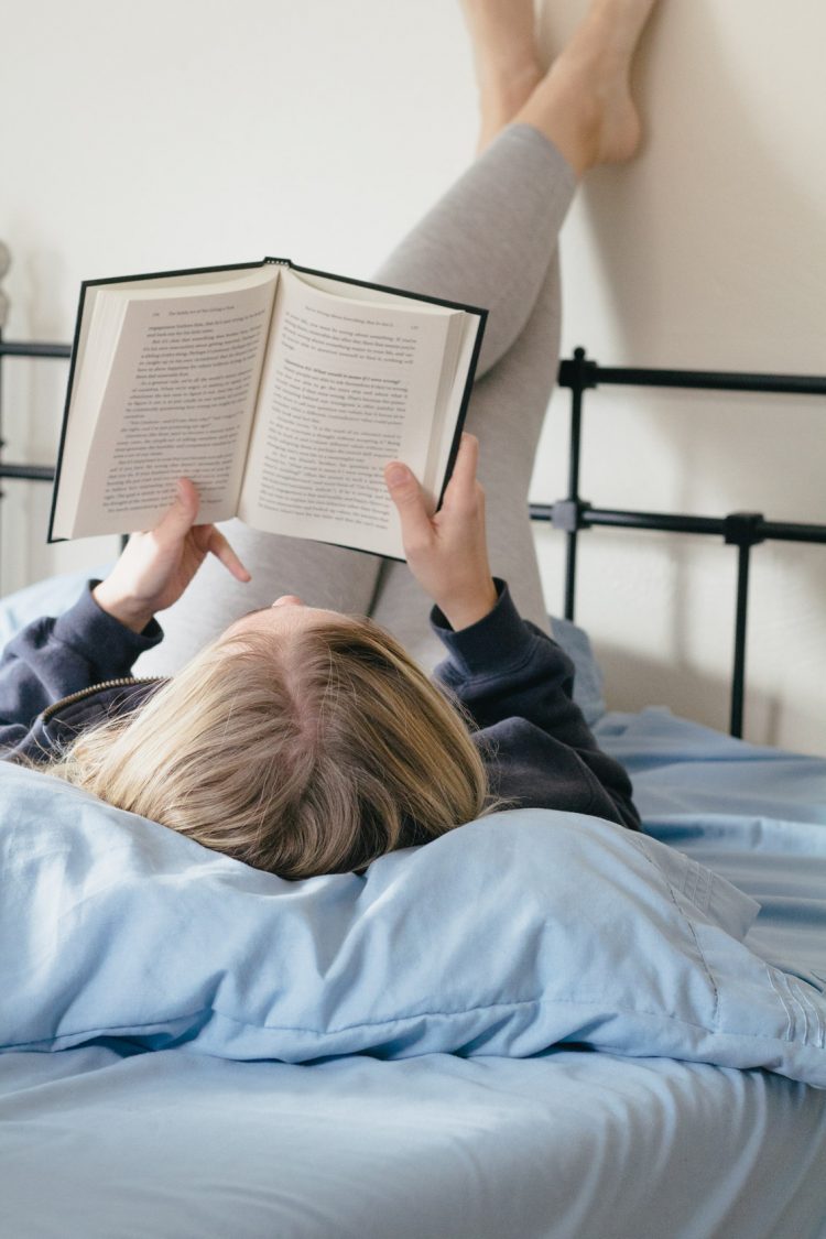 Reading a book in bed | Best self development books | books for self development | self help books amazon
