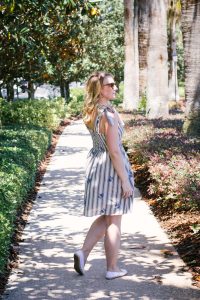 In this summer outfit, lifestyle blogger Allyn Lewis of The Gem styles a playful blue striped dress for a casual look.