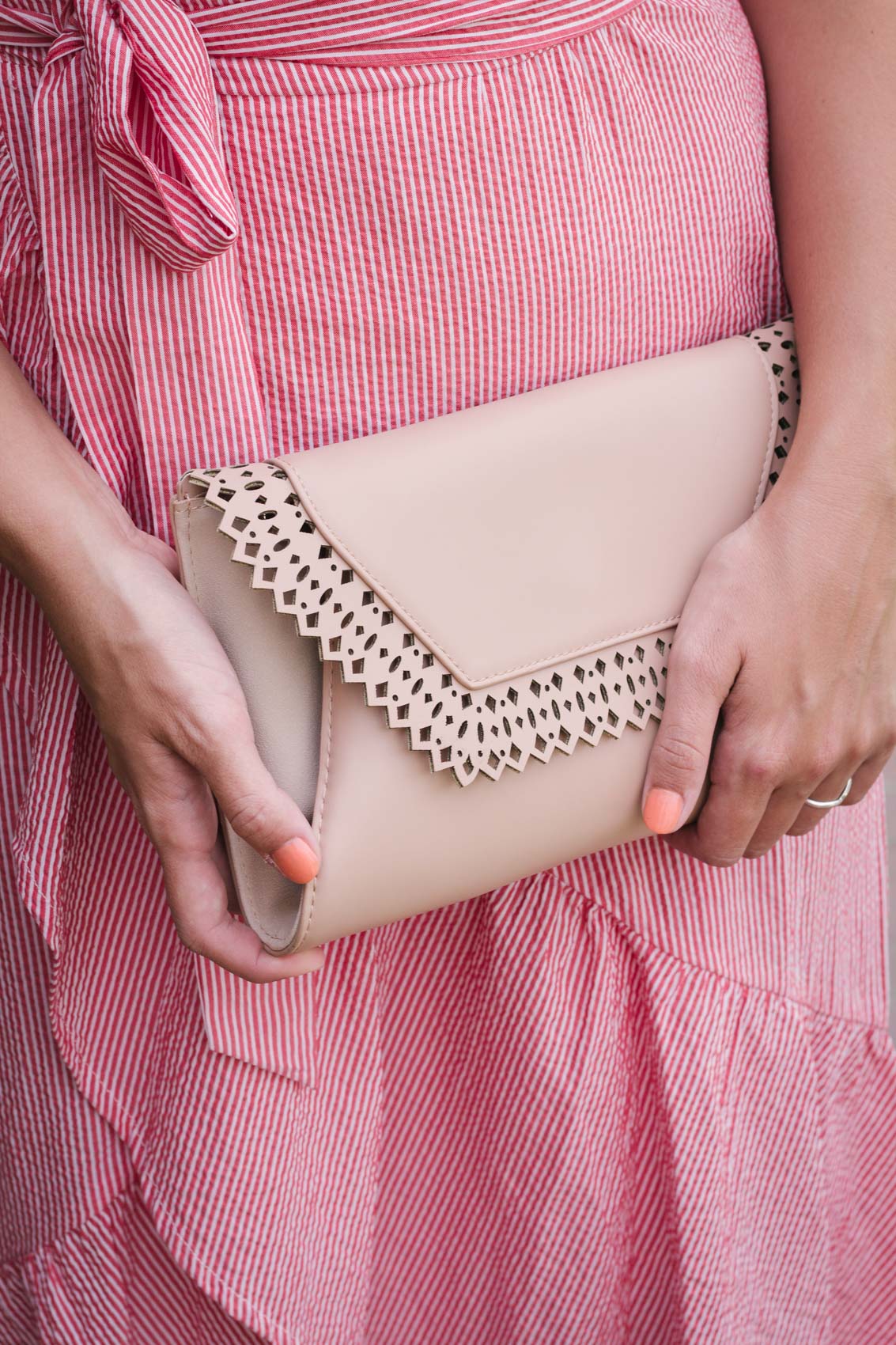 I recently grabbed this envelope clutch at Target, and I can't stop pairing it with my outfits. The nude color has a slight blush tint to it that makes it feminine and perfect to wear with anything. It also comes in a really pretty jade color.