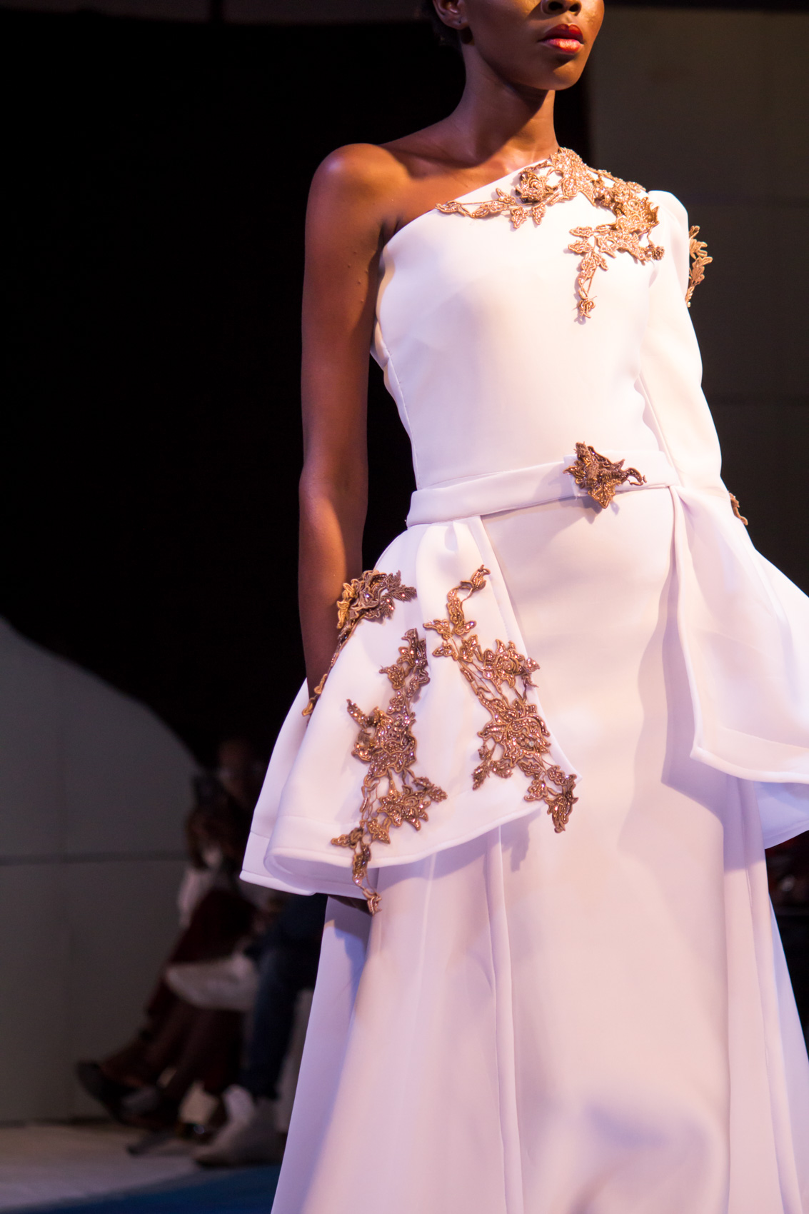 Bronze embellishments on a Madlyn Mode bridal gown at Accra Fashion Week | wedding dress, unique wedding gowns 