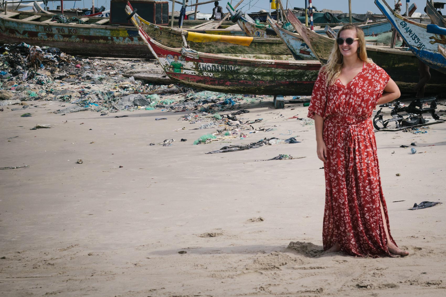 A glimpse into exploring Jamestown - a historically rich fishing community in Accra, Ghana - while wearing a burnt orange maxi dress.