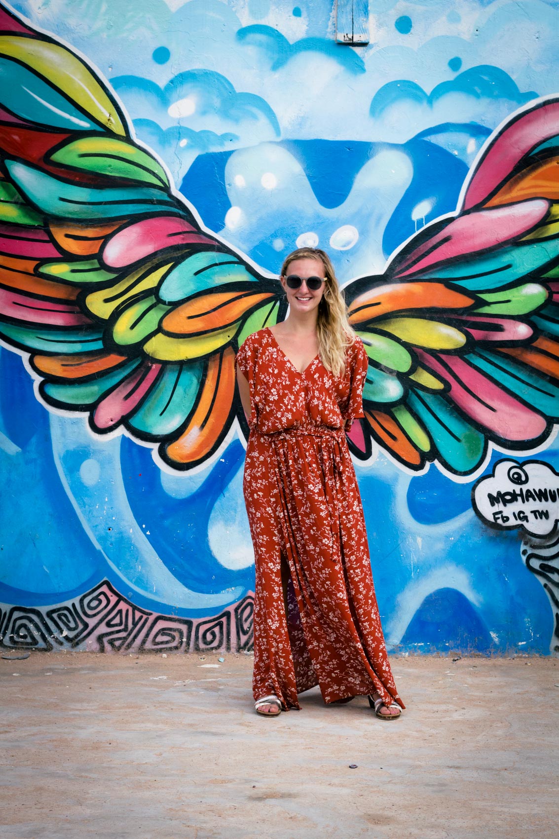 A glimpse into exploring Jamestown - a historically rich fishing community in Accra, Ghana - while wearing a burnt orange maxi dress.