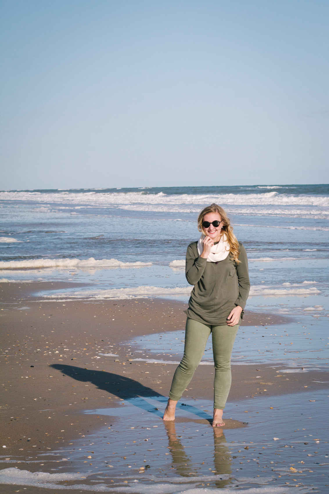 Lifestyle blogger Allyn Lewis of The Gem wears mint green dress, camel  boots, and open cardigan for a styl…