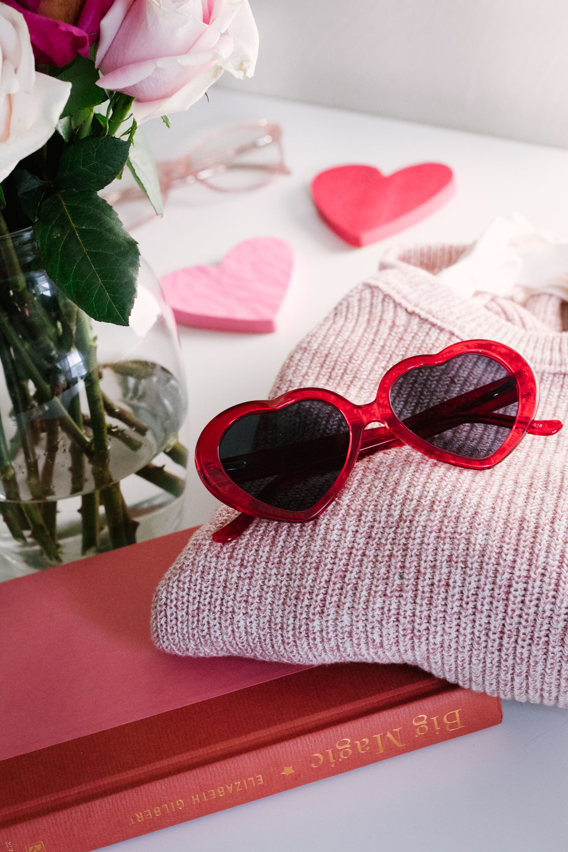 Product photography of red heart sunglasses for Valentine's Day