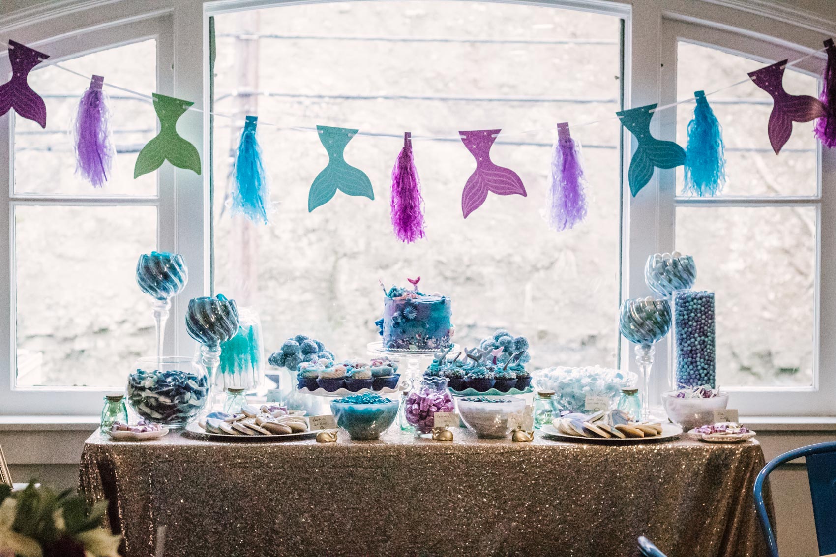 Baby shower mermaid themed dessert and candy table 