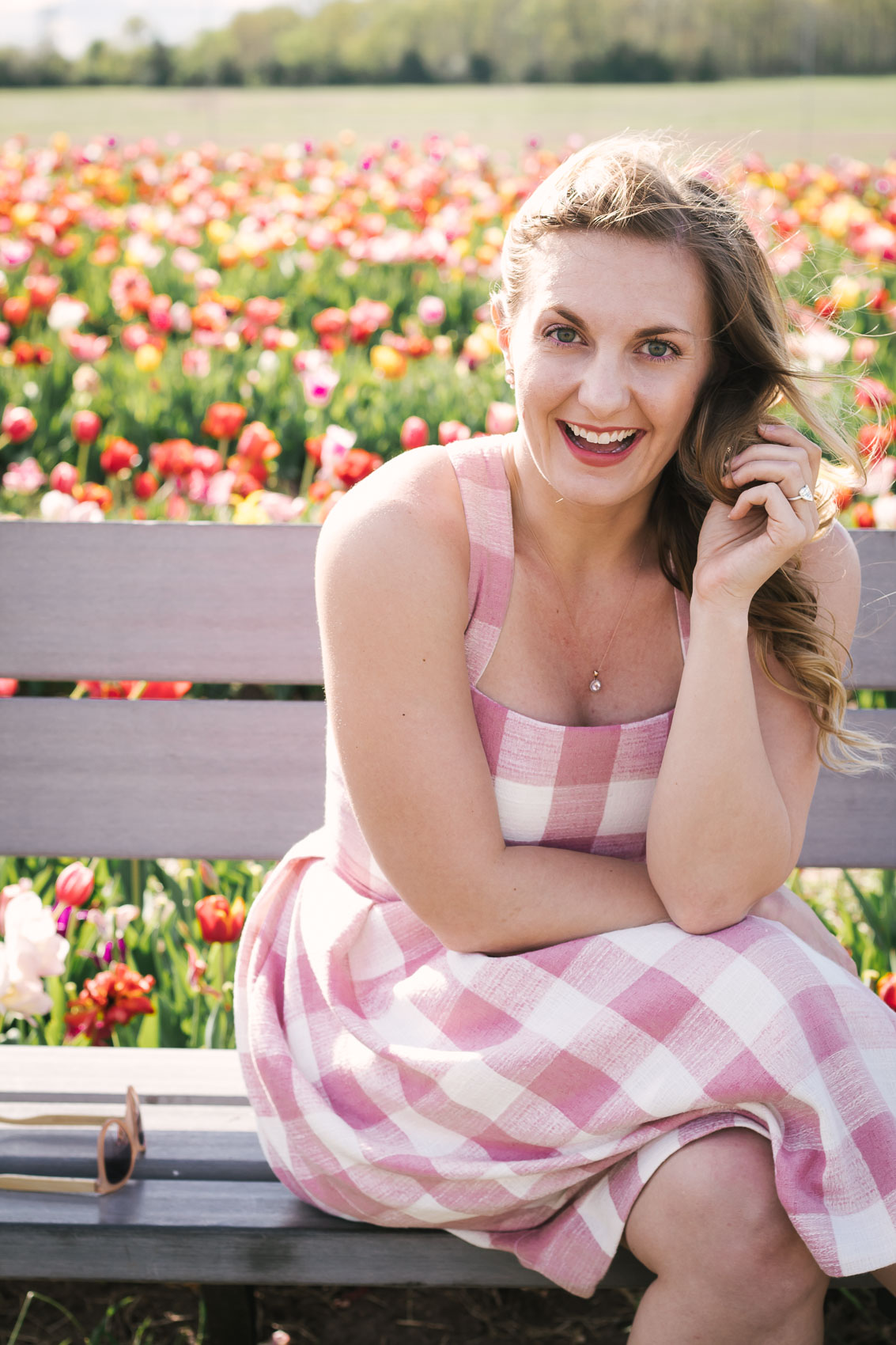 Flower picking in a pink Gal Meets Glam Collection pink gingham dress at Burnside Farms in Nokesville, Virginia | pictures of tulips
