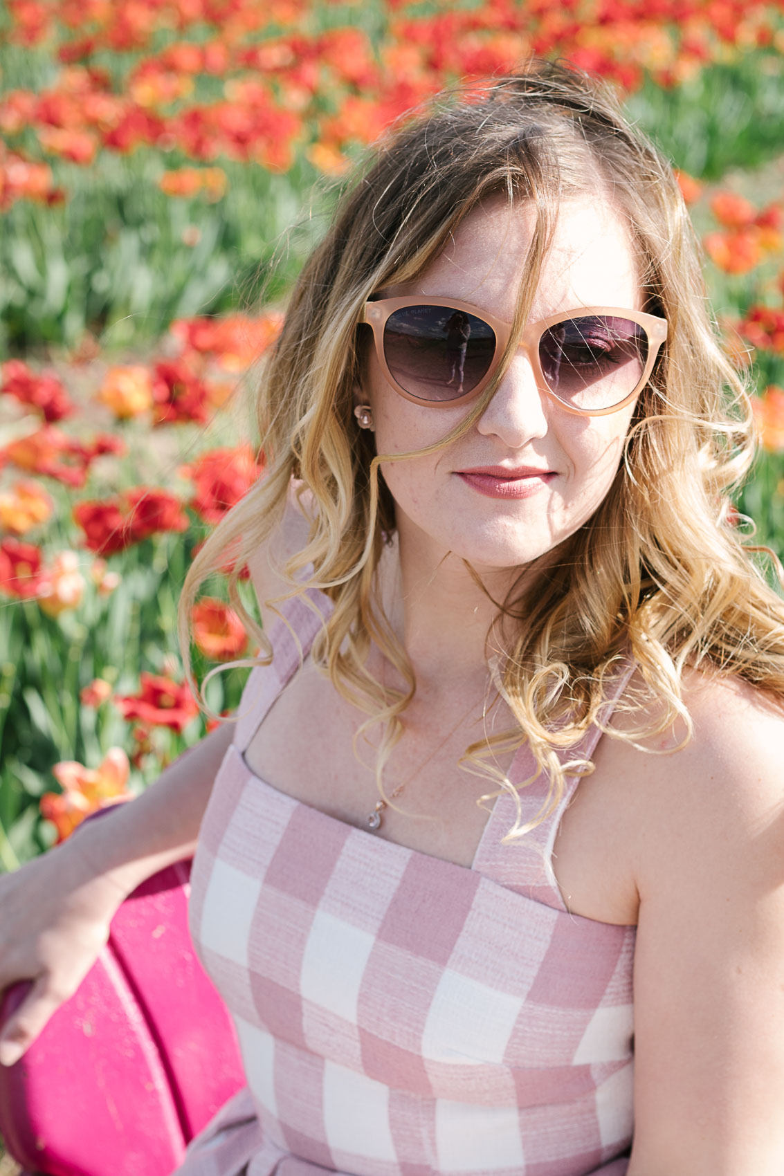 Flower picking in a pink Gal Meets Glam Collection pink gingham dress at Burnside Farms in Nokesville, Virginia | pictures of tulips