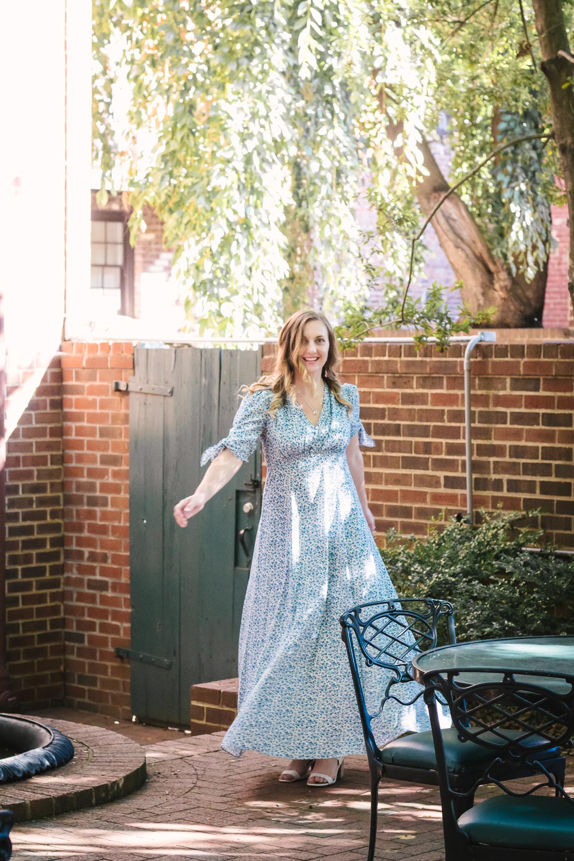 Fashion blogger Allyn Lewis styles the Gal Meets Gal Aurora blue floral maxi dress for a casual Summer outfit on a road trip to Linden Row Inn - A historic boutique hotel in Richmond, Virginia 