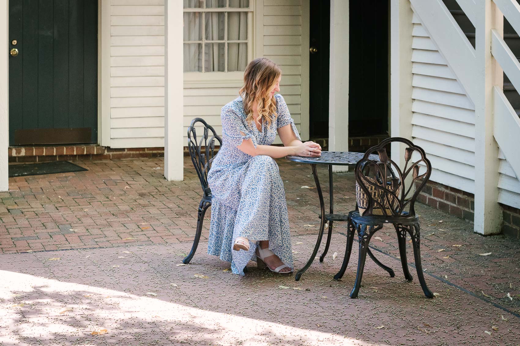 Fashion blogger Allyn Lewis styles the Gal Meets Gal Aurora blue floral maxi dress for a casual Summer outfit on a road trip to Linden Row Inn - A historic boutique hotel in Richmond, Virginia 