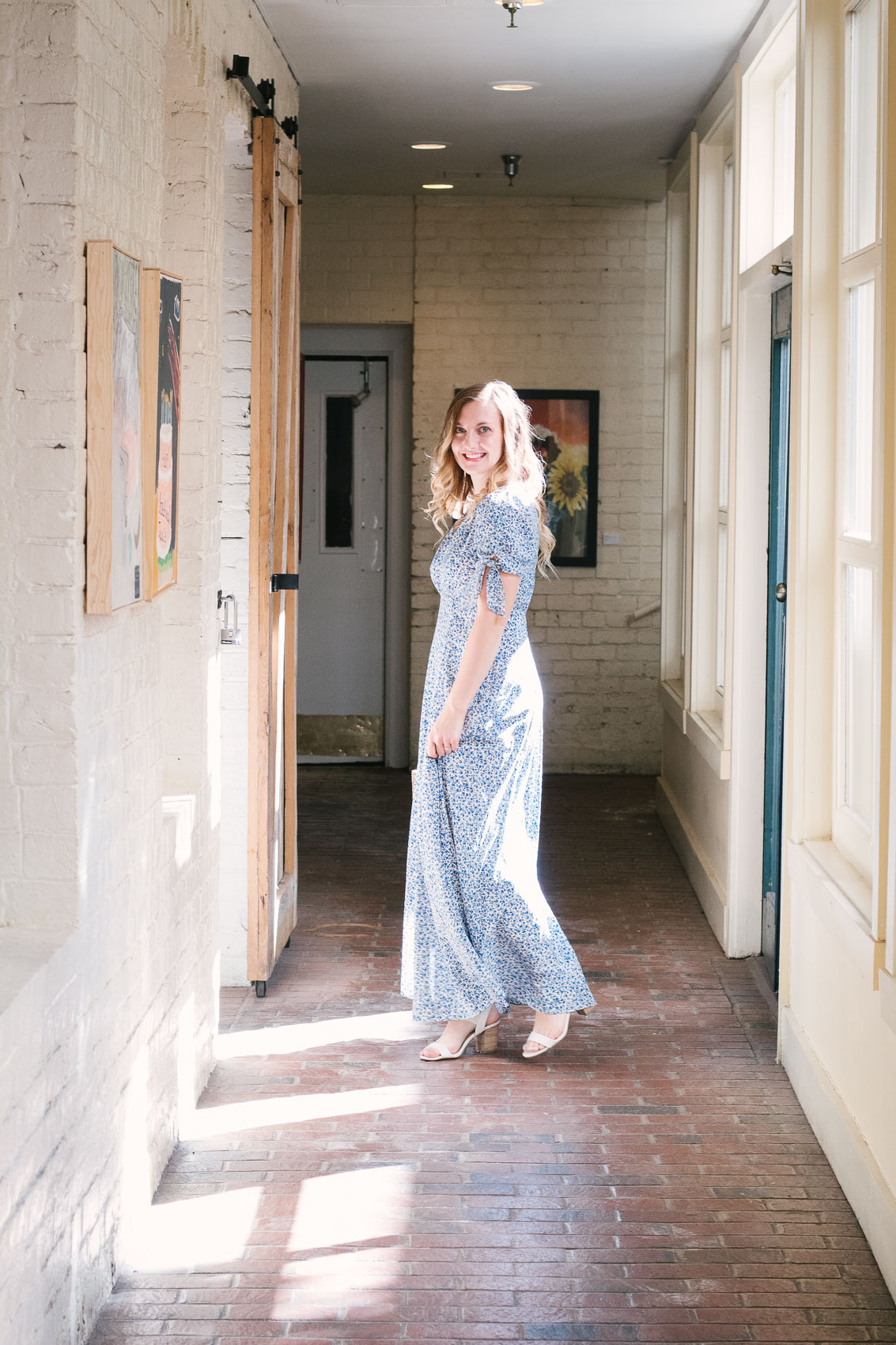 Fashion blogger Allyn Lewis styles the Gal Meets Gal Aurora blue floral maxi dress for a casual Summer outfit on a road trip to Linden Row Inn - A historic boutique hotel in Richmond, Virginia 