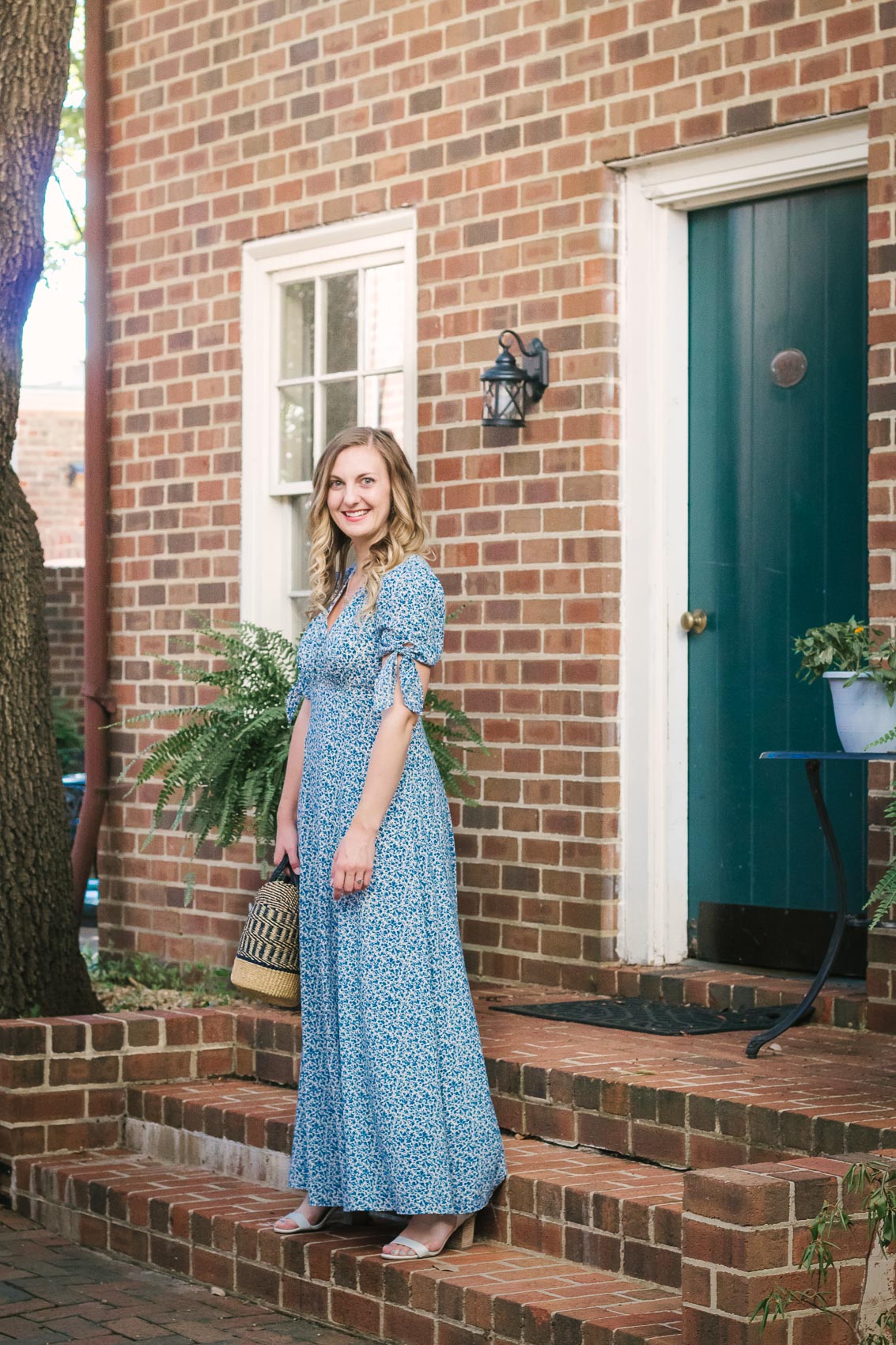 Fashion blogger Allyn Lewis styles the Gal Meets Gal Aurora blue floral maxi dress for a casual Summer outfit on a road trip to Linden Row Inn - A historic boutique hotel in Richmond, Virginia 