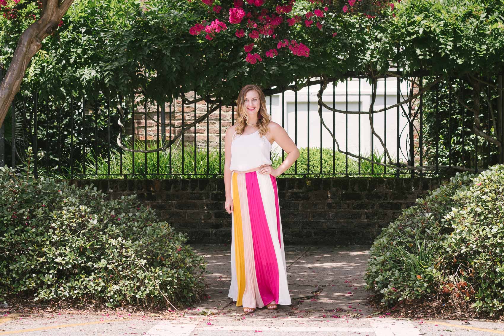 Fashion blogger Allyn Lewis styles a color blocked pleated maxi skirt for a day exploring Charleston, SC. | How to style a pleated maxi skirt | summer outfit inspiration 