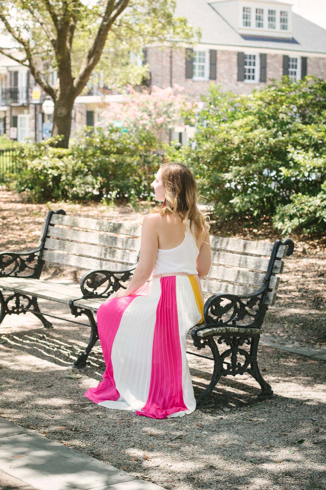 Fashion blogger Allyn Lewis styles a color blocked pleated maxi skirt for a day exploring Charleston, SC. | How to style a pleated maxi skirt | summer outfit inspiration 