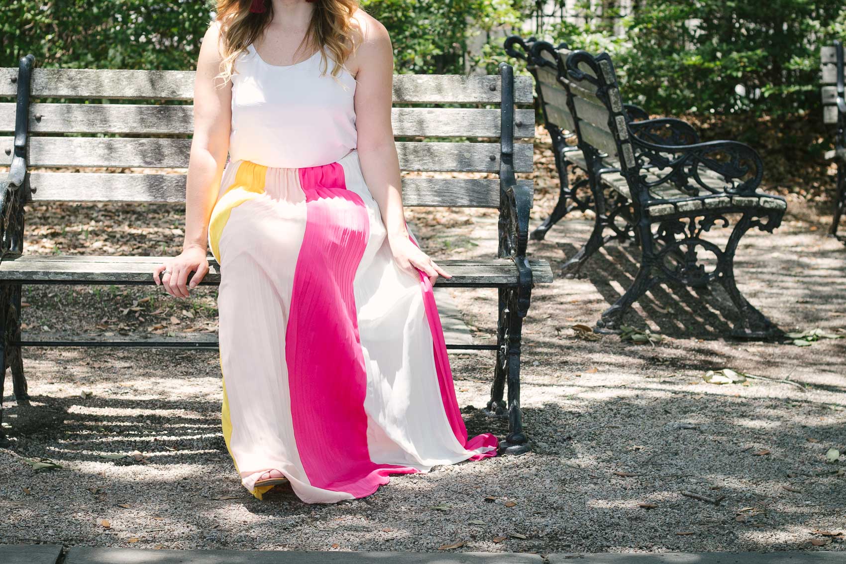 Fashion blogger Allyn Lewis styles a color blocked pleated maxi skirt for a day exploring Charleston, SC. | How to style a pleated maxi skirt | summer outfit inspiration 