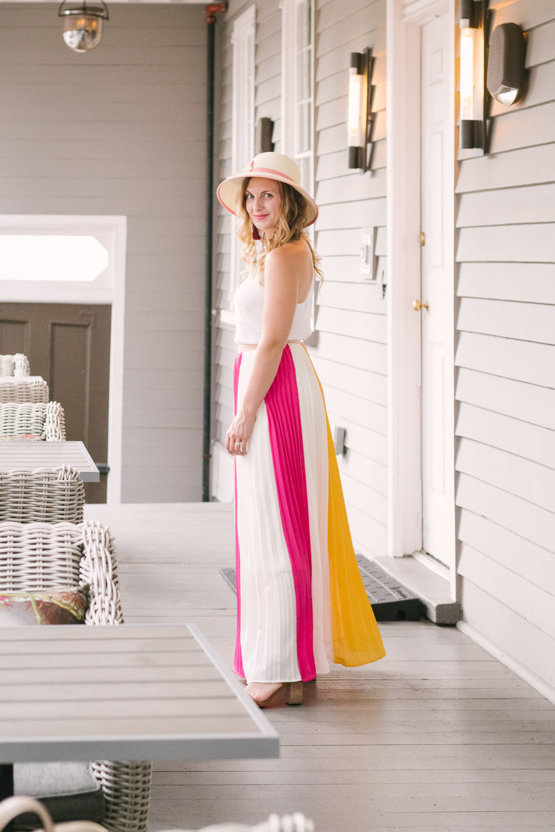 Fashion blogger Allyn Lewis styles a color blocked pleated maxi skirt for a day exploring Charleston, SC. | How to style a pleated maxi skirt | summer outfit inspiration 