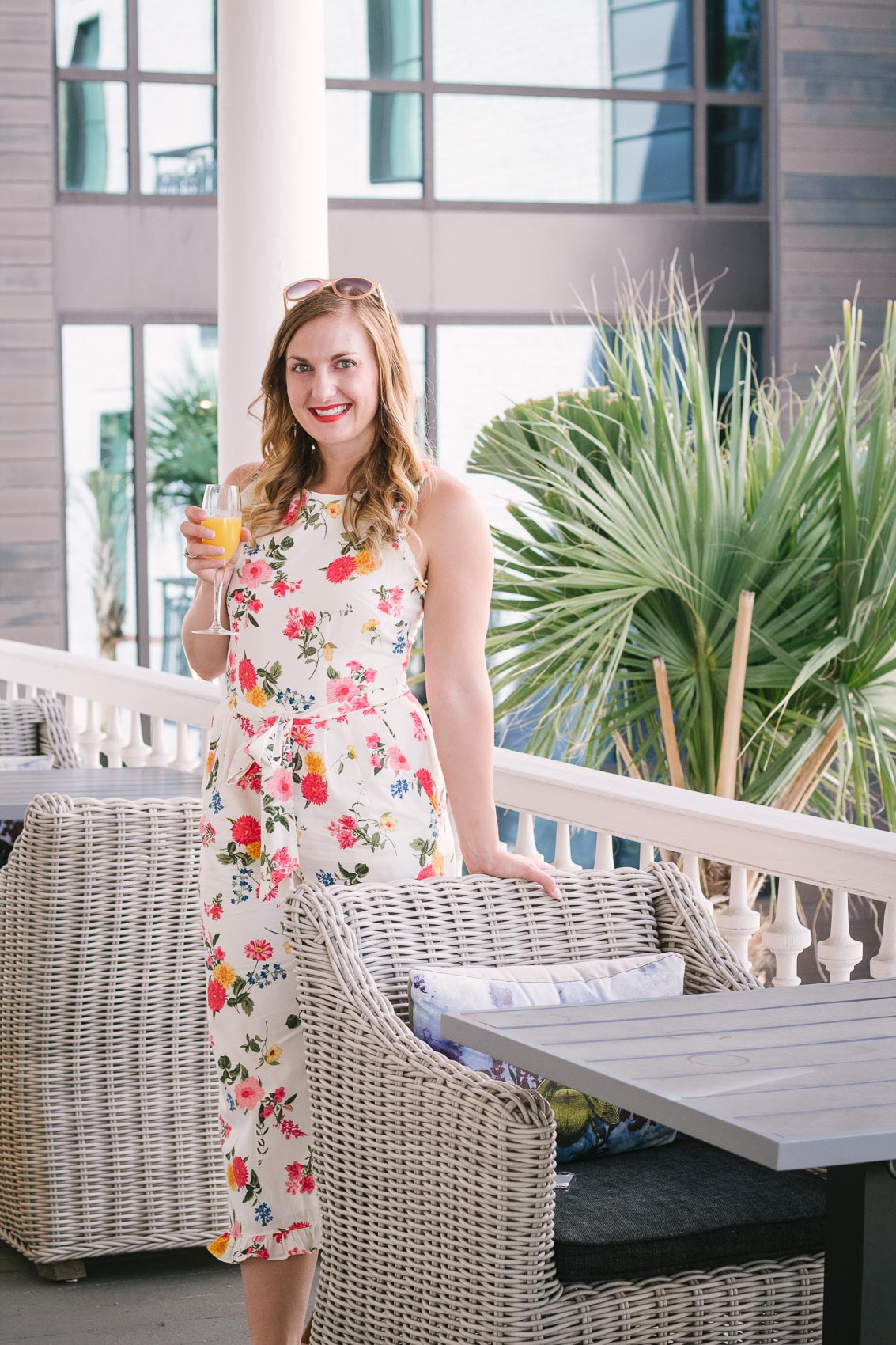 Casual summer outfit - Fashion and travel blogger Allyn Lewis styles the Gal Meets Glam Collection beverly jumpsuit at Hotel Bella Grace in Charleston, SC