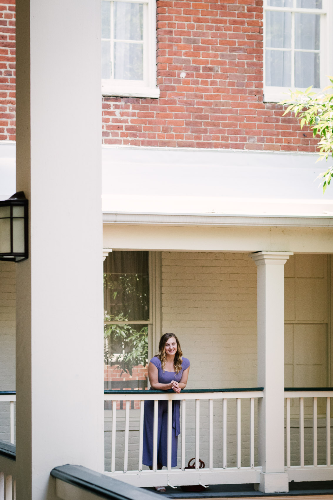 Fashion blogger Allyn Lewis styles the Gal Meets Gal Veronica purple crepe jumpsuit for a casual Summer outfit on a road trip to Linden Row Inn - A historic boutique hotel in Richmond, Virginia