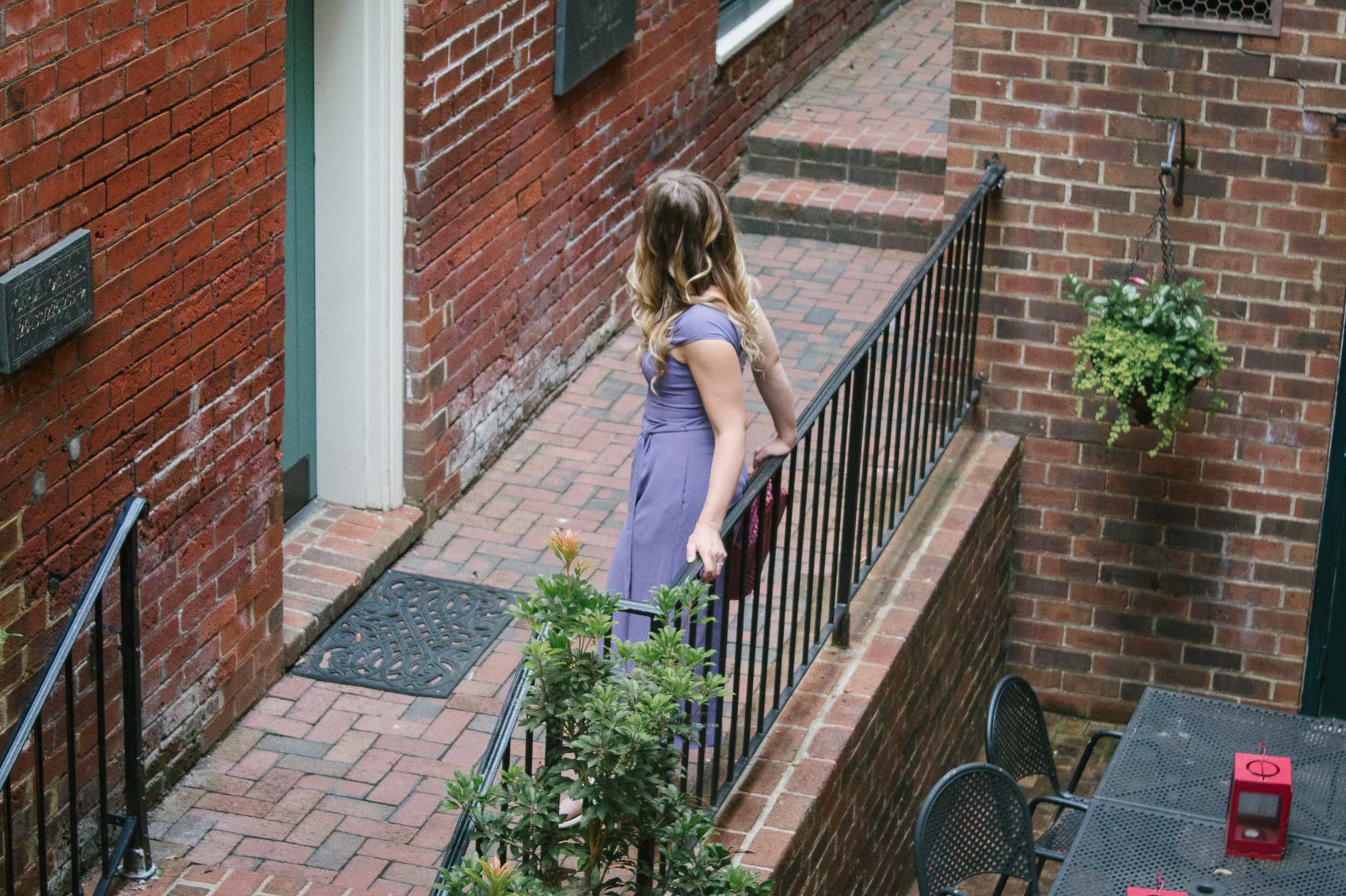 Fashion blogger Allyn Lewis styles the Gal Meets Gal Veronica purple crepe jumpsuit for a casual Summer outfit on a road trip to Linden Row Inn - A historic boutique hotel in Richmond, Virginia