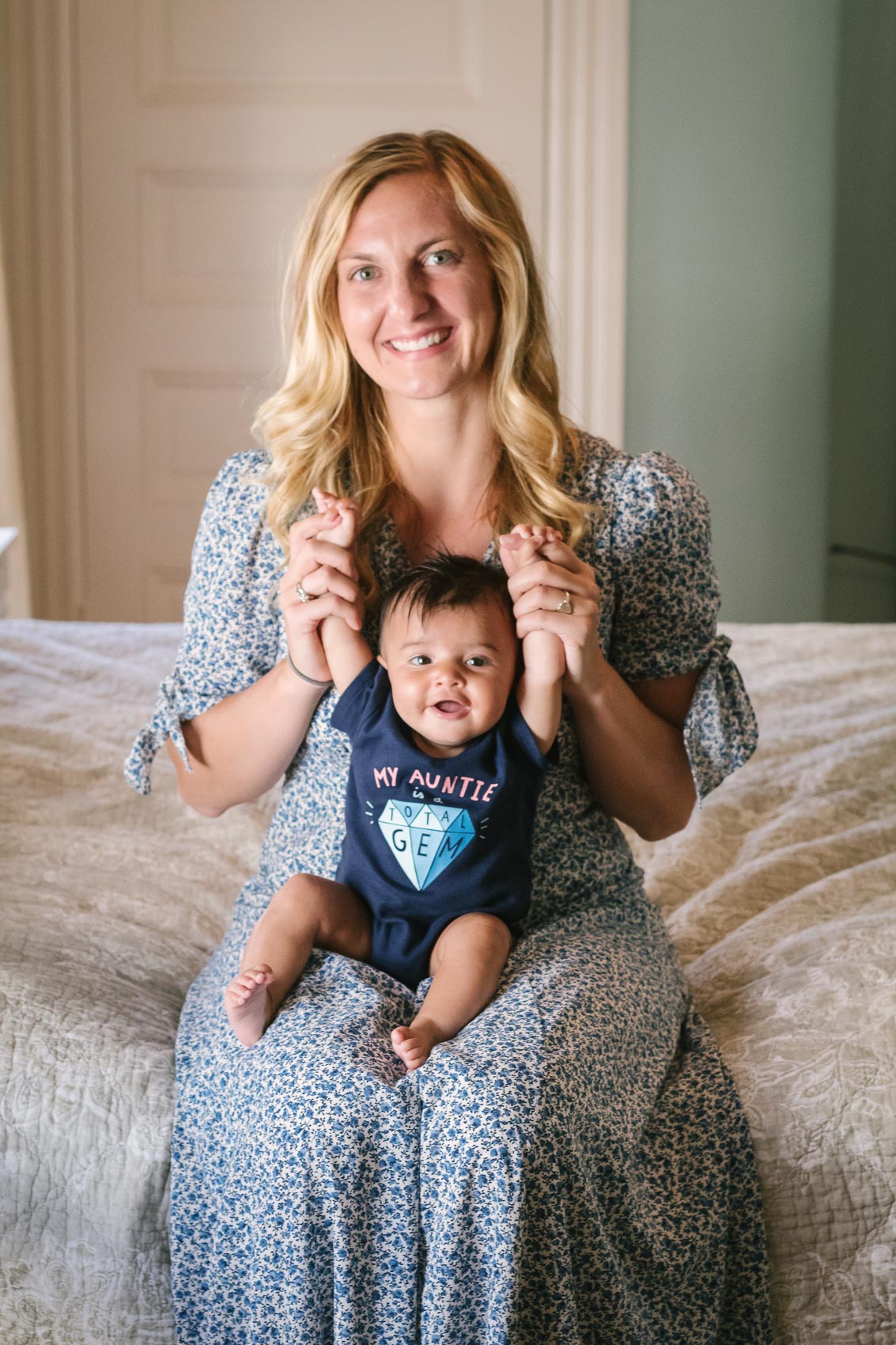 Fashion blogger Allyn Lewis in the Gal Meets Glam Aurora dress with her niece in a "My Auntie is a Total Gem" onesie