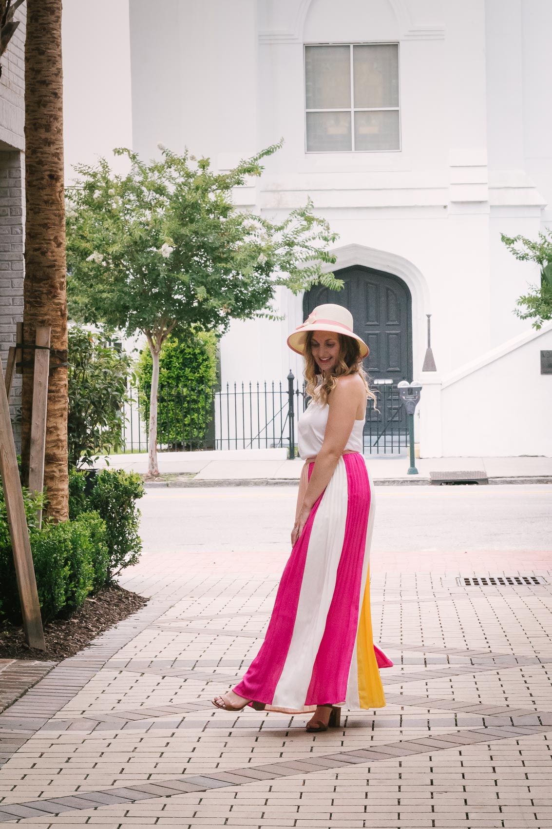 Fashion blogger Allyn Lewis styles a color blocked pleated maxi skirt for a day exploring Charleston, SC. | How to style a pleated maxi skirt | summer outfit inspiration