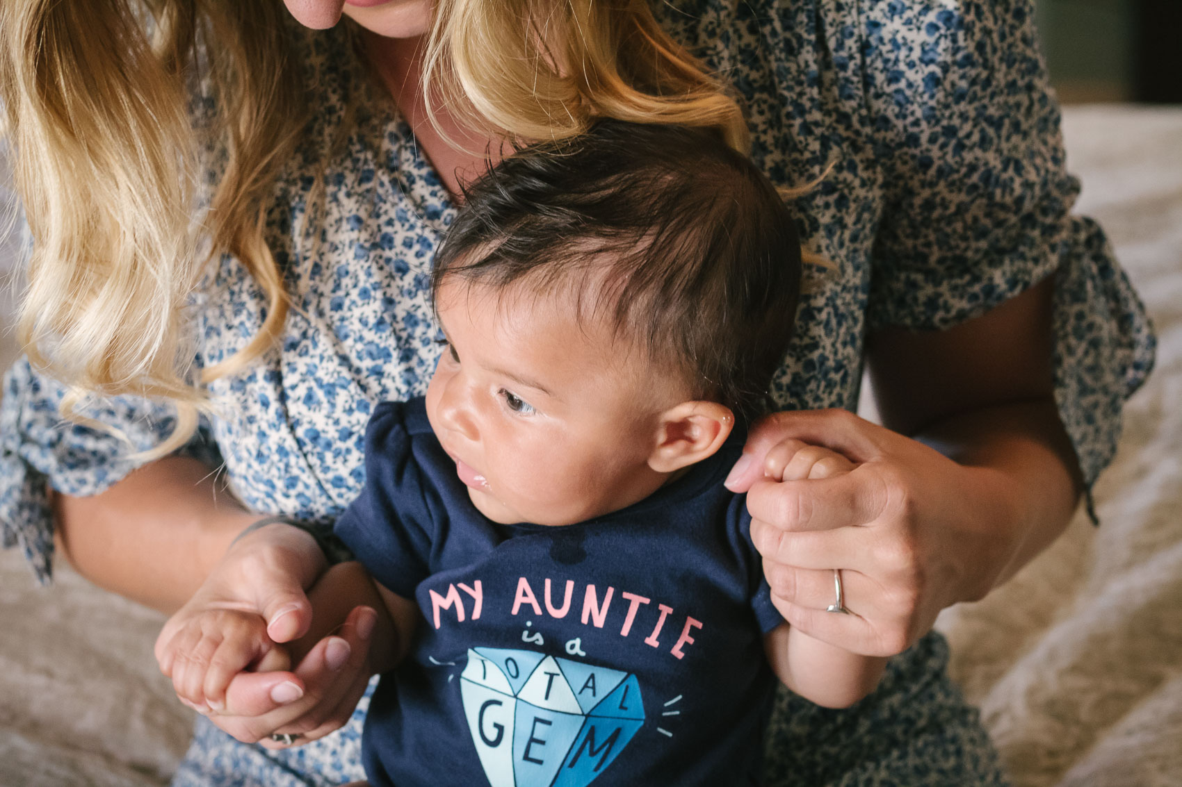 Fashion blogger Allyn Lewis in the Gal Meets Glam Aurora dress with her niece in a "My Auntie is a Total Gem" onesie