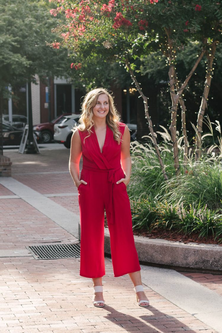 Allyn Lewis from The Gem styles a red jumpsuit from London Times for an elegant, casual outfit while exploring New Bern, NC.