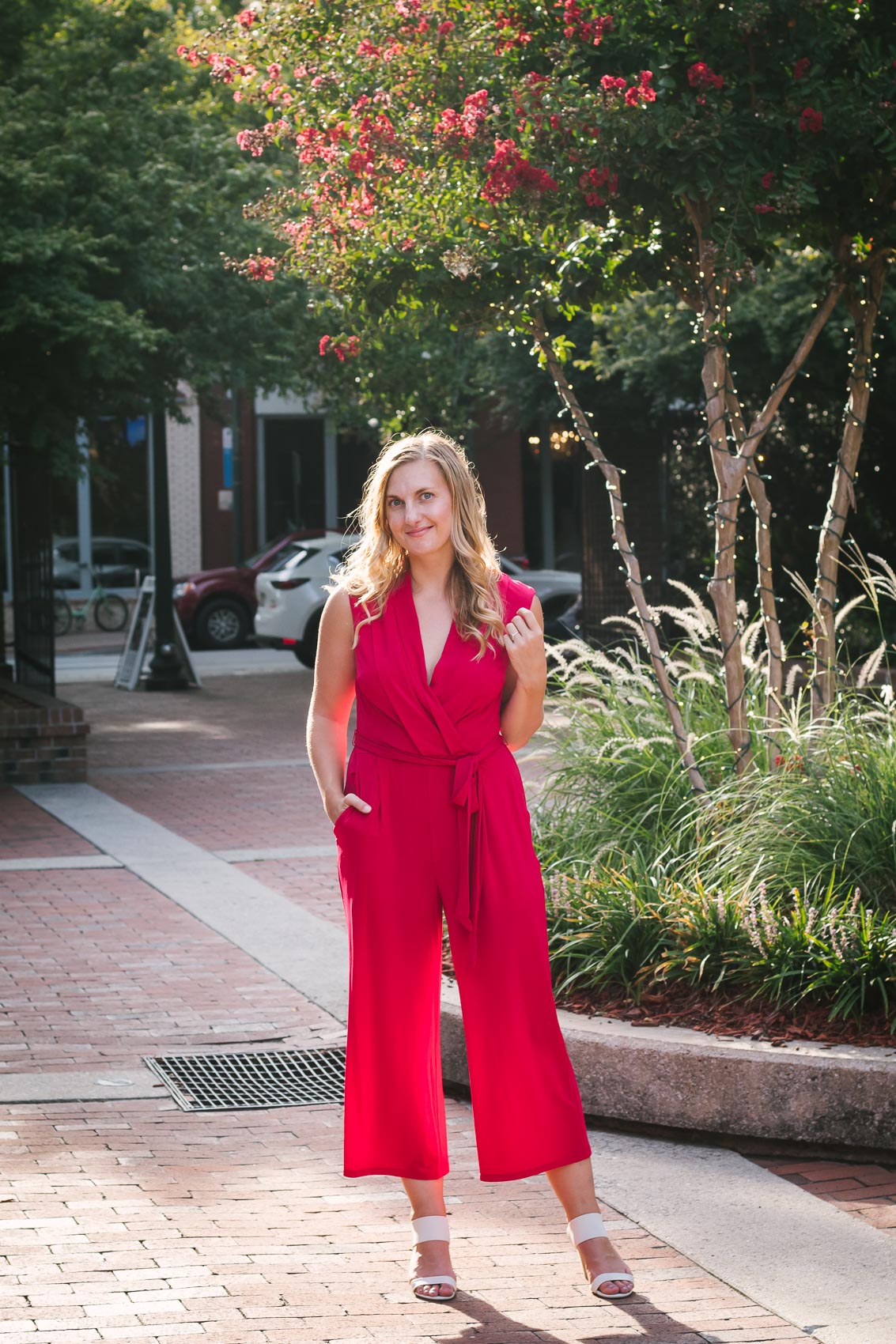 Fashion blogger Allyn Lewis styles a London Times red jumpsuit for an easy fall outfit