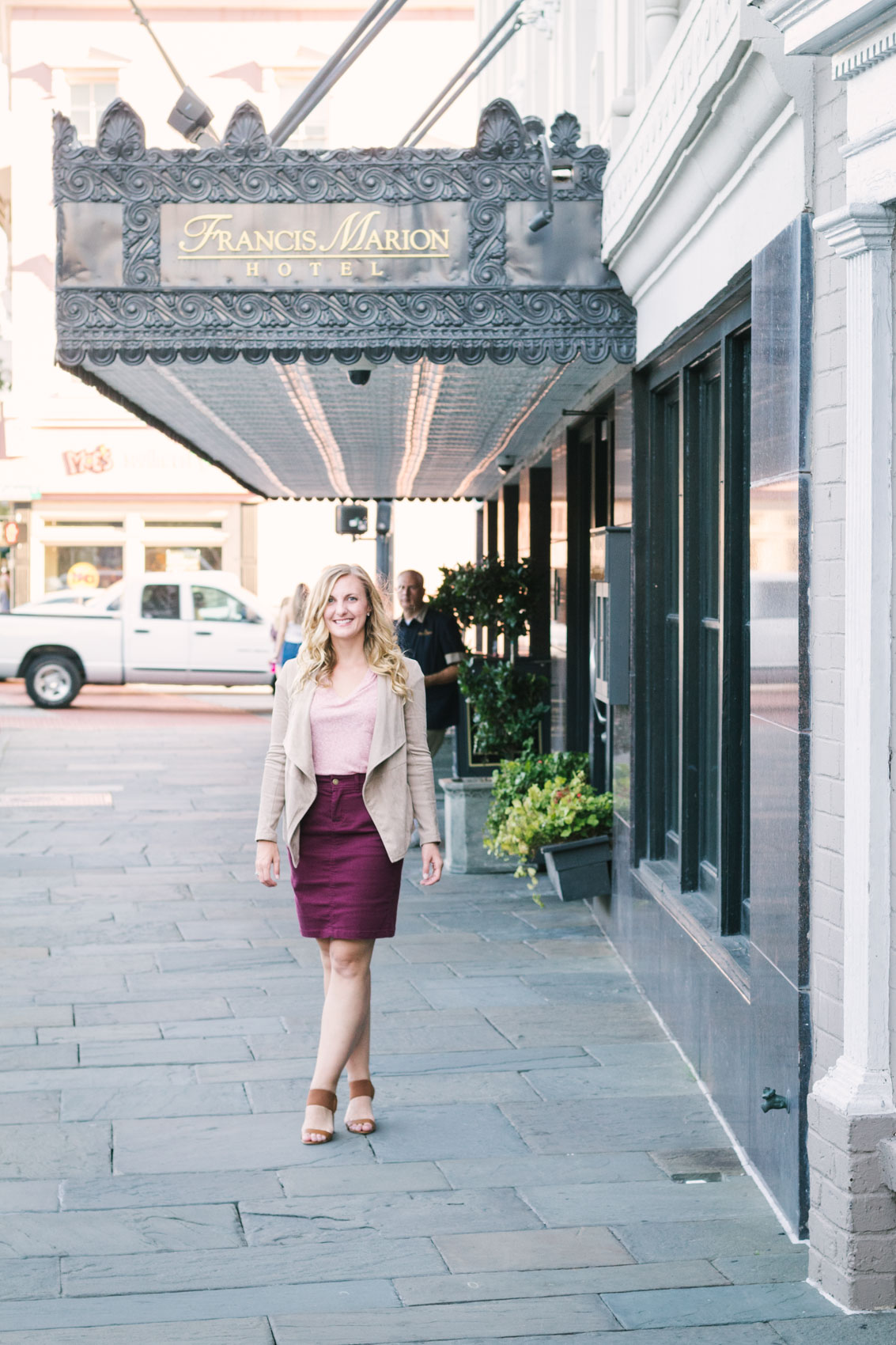 Allyn Lewis of The Gem styles a casual fall outfit with a burgundy pencil skirt, block heels, and faux suede drape jacket. 