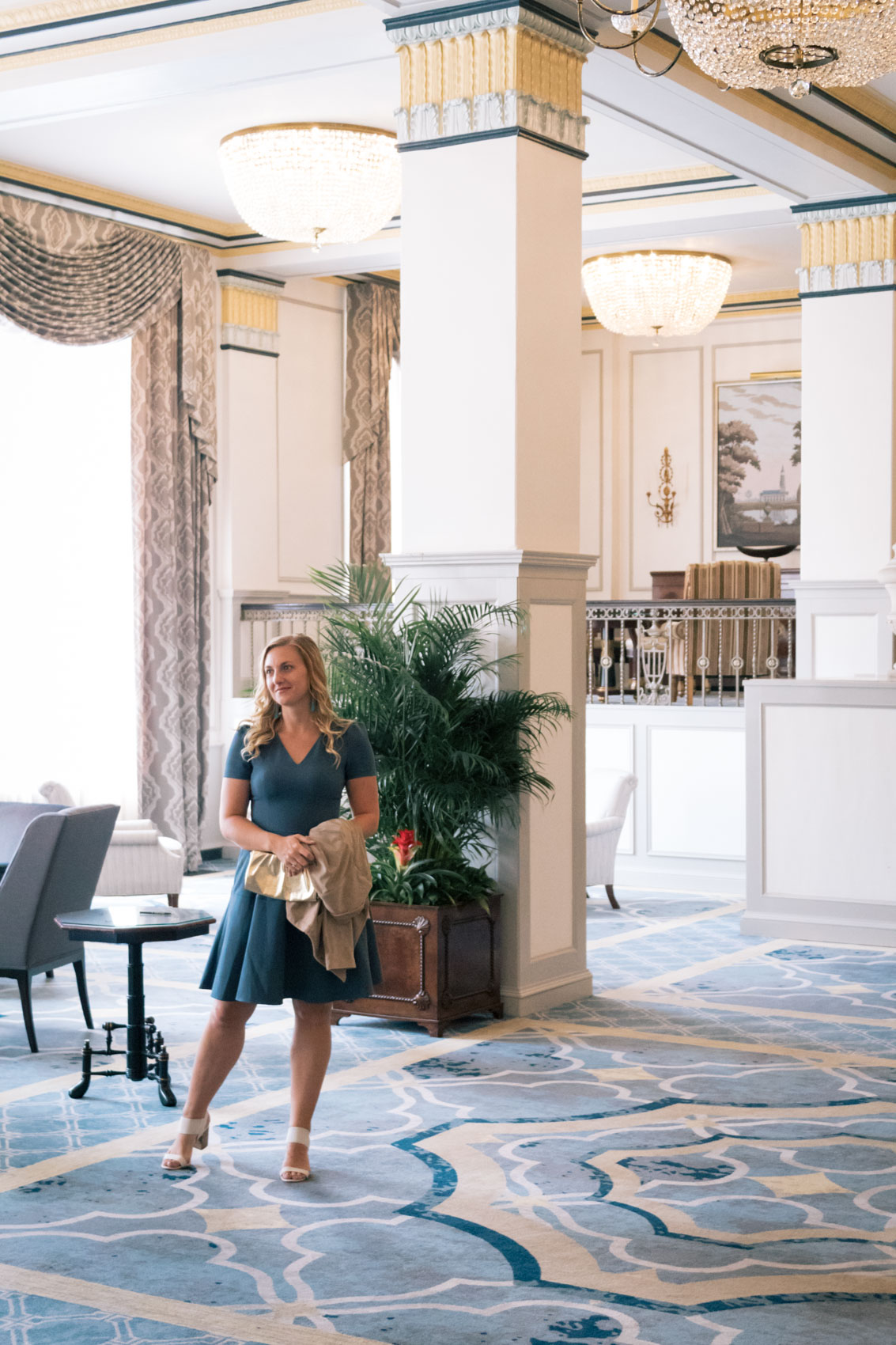 Allyn Lewis styles a Gal Meets Glam Collection fit and flare dress with pockets that is so versatile it can be worn in any season and to every occasion - workdays, weekends, and even weddings. Paired here with a BB Dakota faux suede drape jacket and Report Shoes block heels at The Francis Marion Hotel in Charleston, SC for a casual fall outfit.