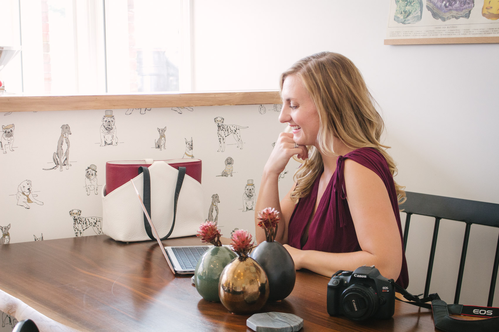 Allyn Lewis of The Gem styles a surplice oxblood casual jumpsuit as a classy summer to fall transitional outfit for a coffee date at Reginald's Coffee in Pittsburgh, PA. 