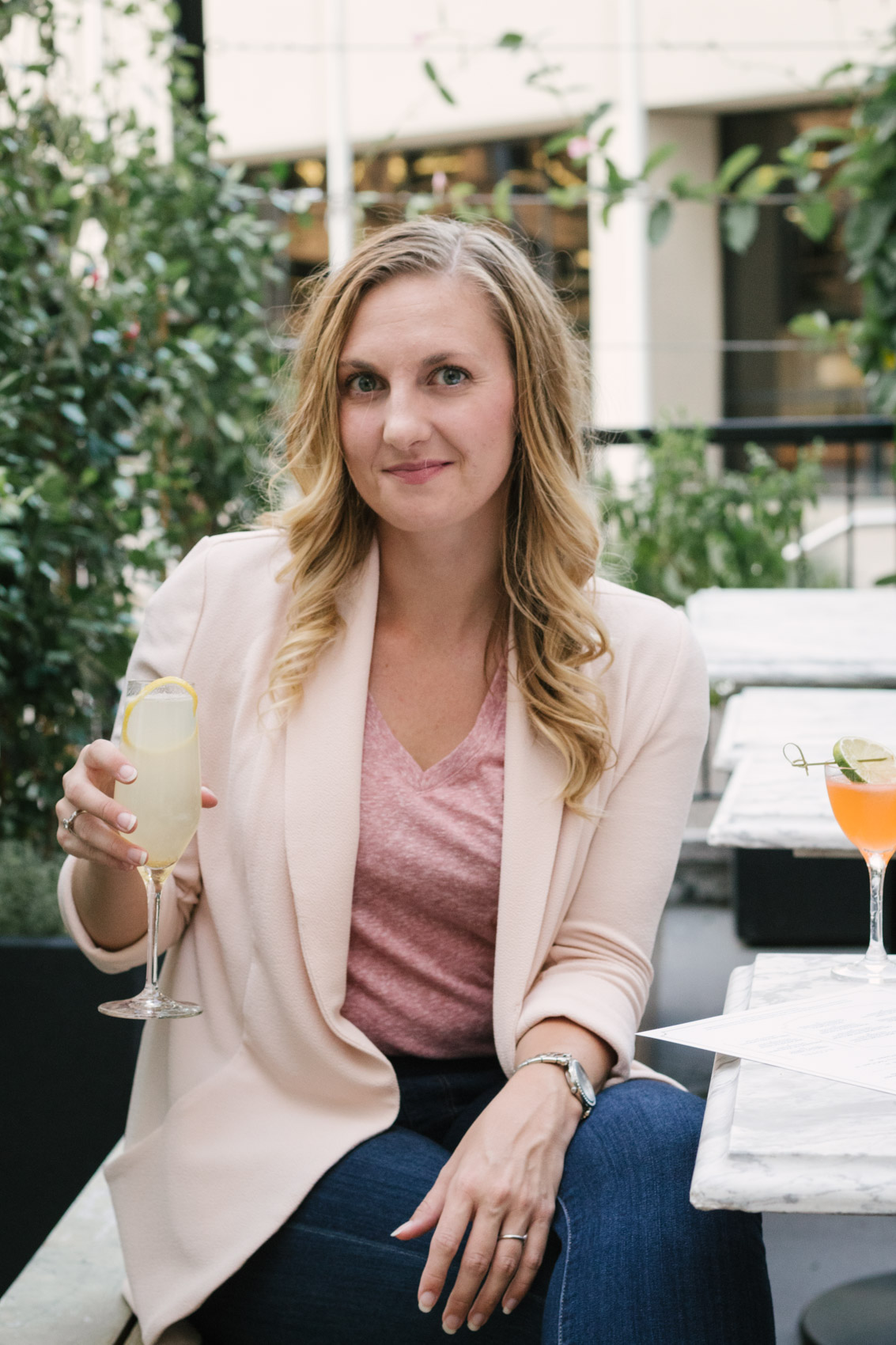 Pair a pink blazer over a simple t-shirt for an easy, classy outfit