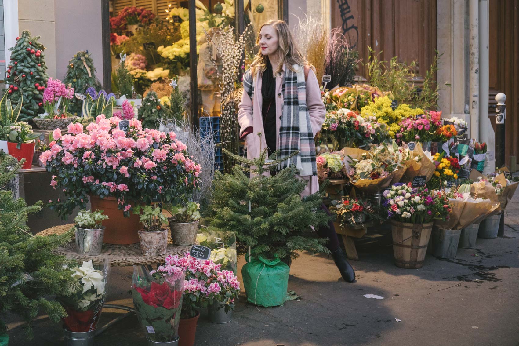 Pastel blush pink coat at a cute floral shop in Paris. 