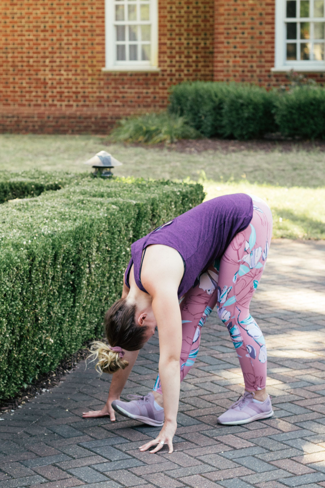 Allyn Lewis shares running tips for beginners in a floral leggings outfit. 