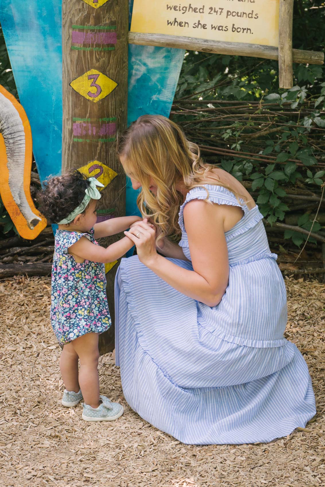 The Gal Meets Glam Courtney Dress from Gal Meets Glam Collection is a summer must have with its maxi dress silhouette, ruffle details, and blue and white stripe print. | casual summer outfit | dress with sneakers outfit 