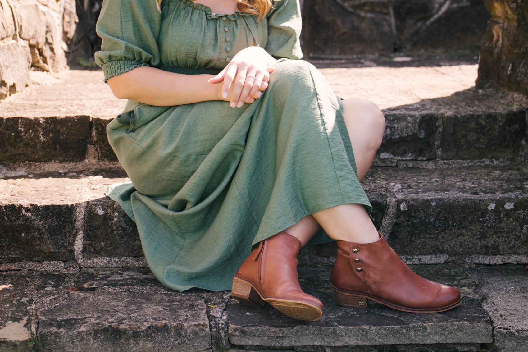 Allyn Lewis styles a romantic green maxi dress with fall ankle booties for an early fall outfit