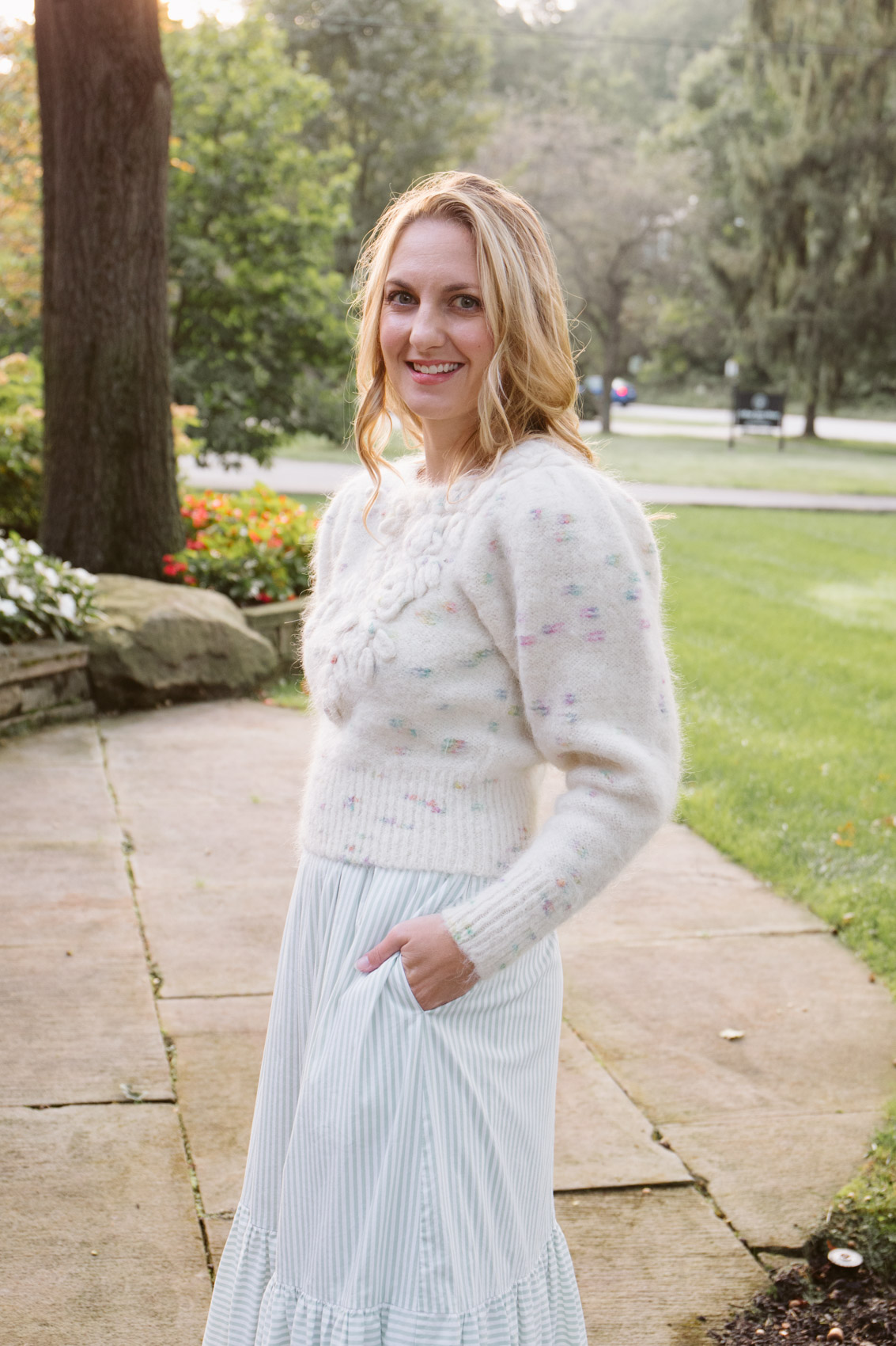 LoveShackFancy Claudette Sweater styled over a Gal Meets Glam Collection maxi dress for a fall or winter outfit