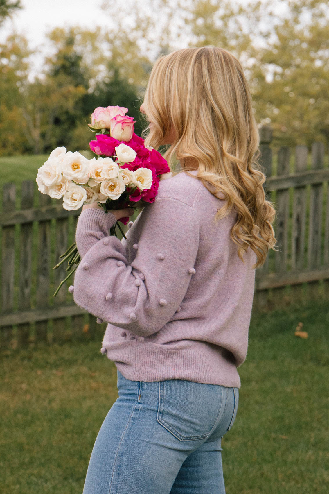 Purple bobble sweater and high waisted Perfect Vintage jeans from Madewell (girl holding roses)