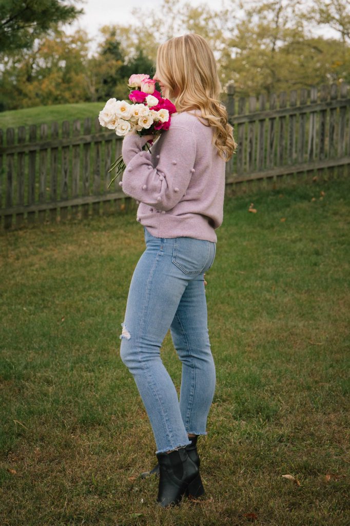 Purple bobble sweater and high waisted Perfect Vintage jeans from Madewell (girl holding roses)