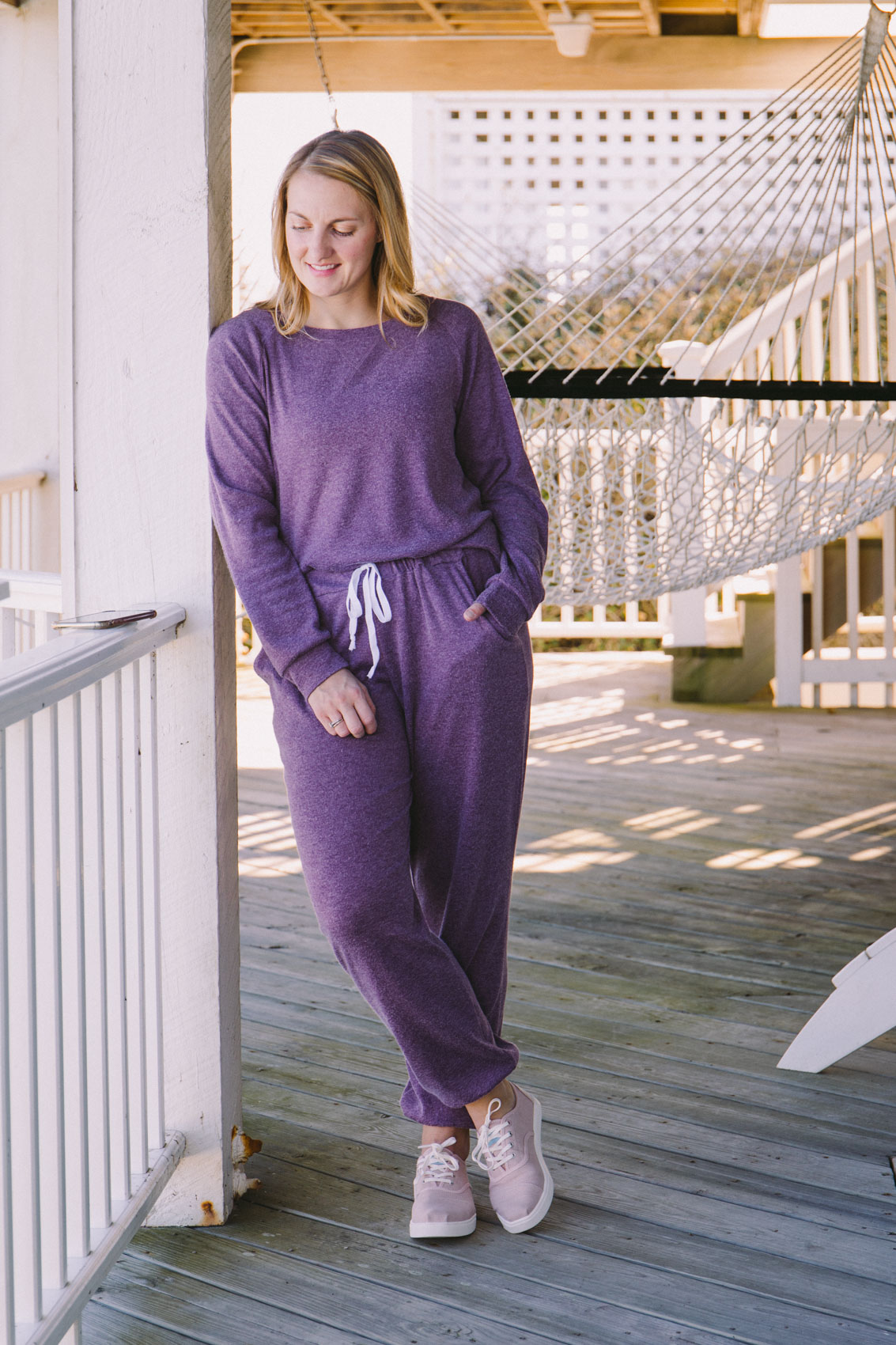 Cute Amazon loungewear outfit featuring purple sweatsuit and pink sneakers