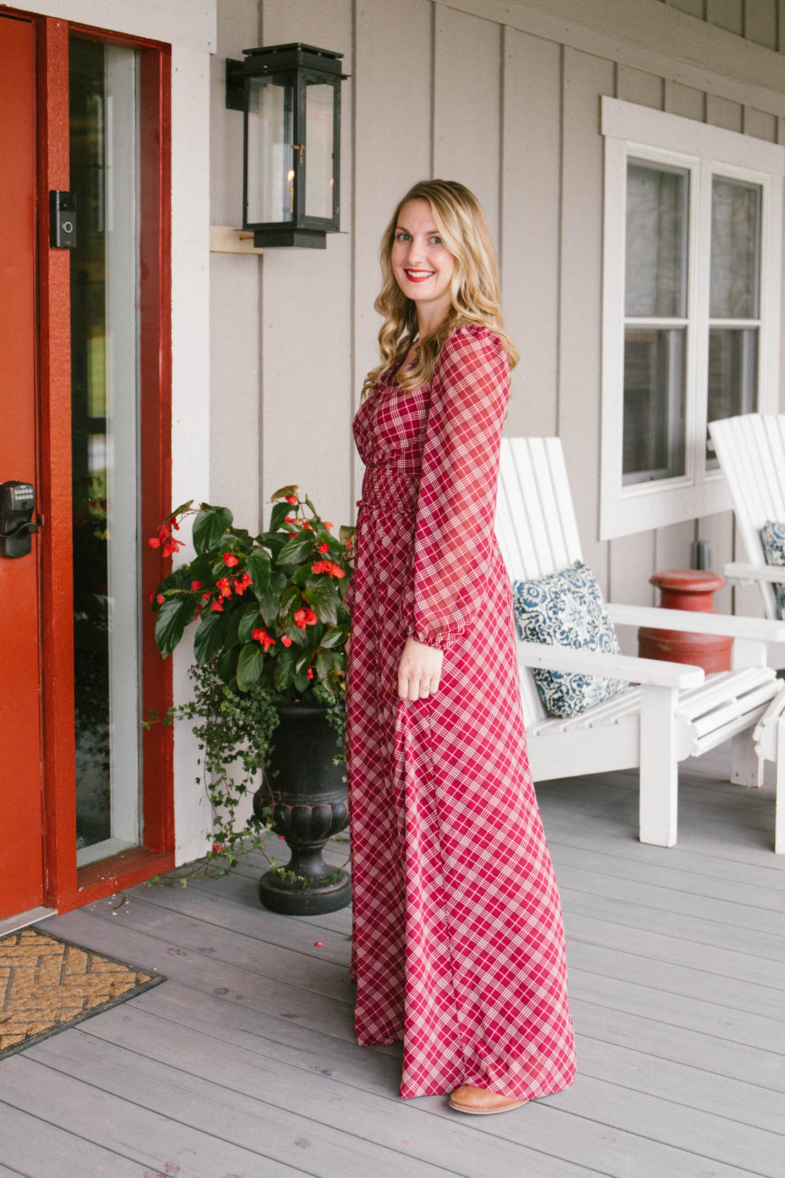 Allyn Lewis styles a red Gal Meets Glam maxi dress in front of Red Barn Inn in Deep Creek, MD. 