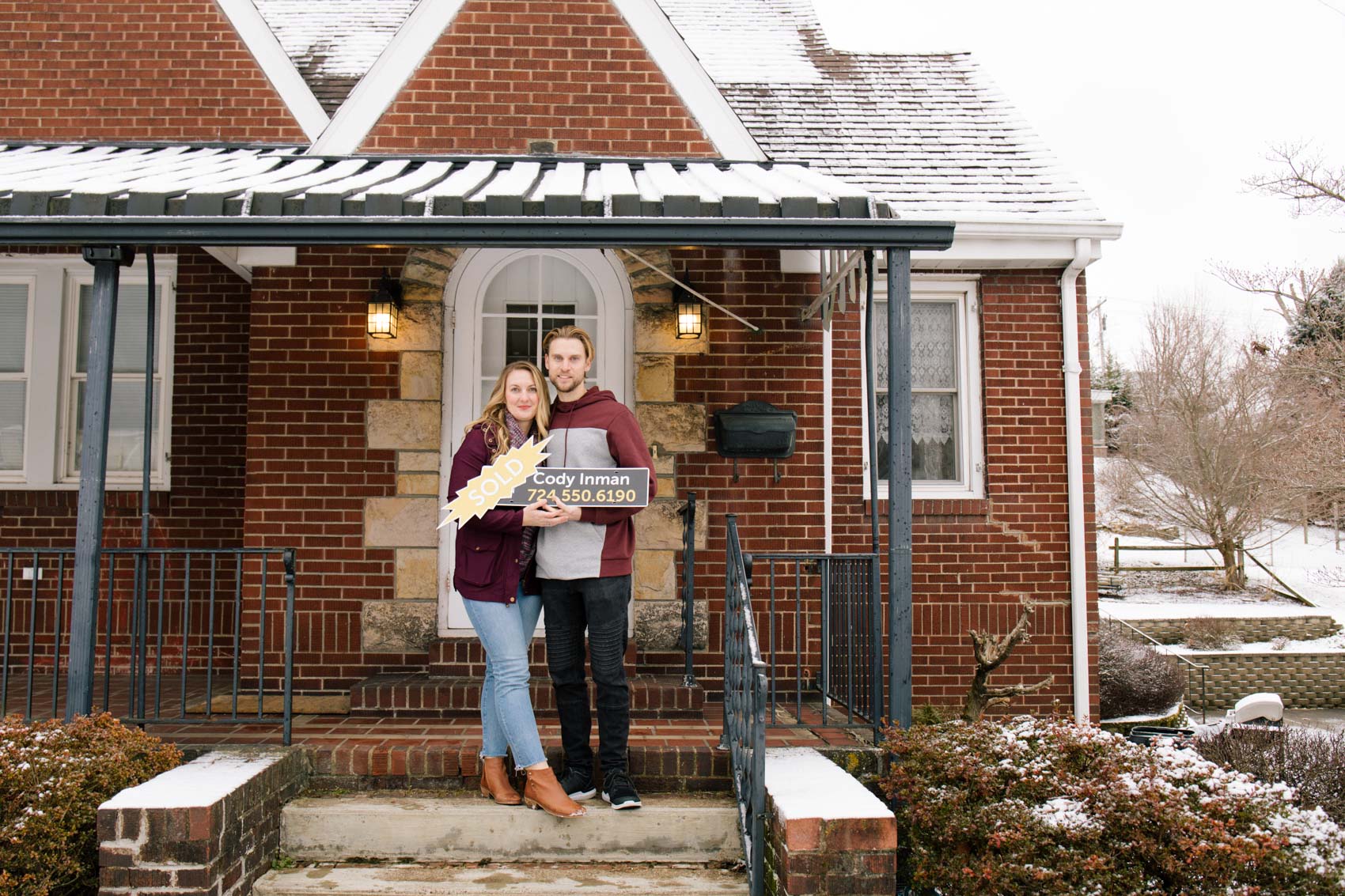 Brick cape code home with homeowners