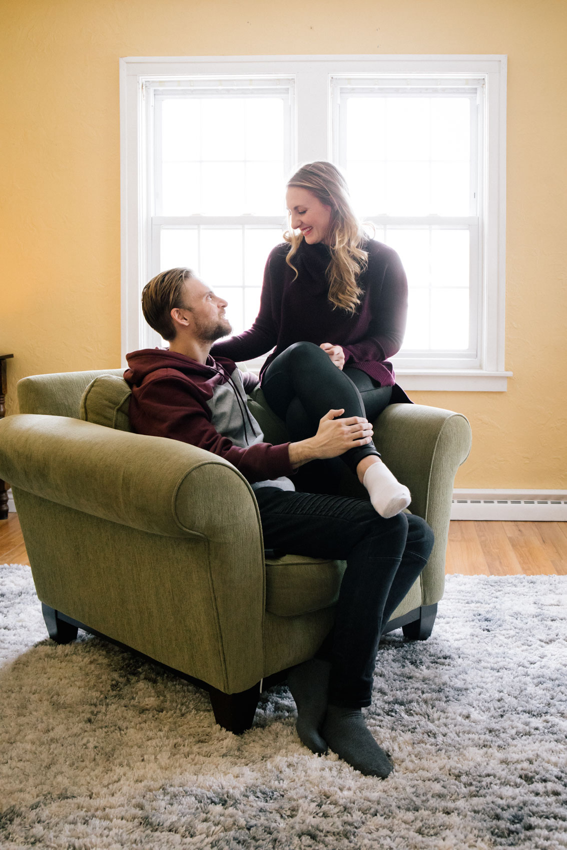 lifestyle blogger Allyn Lewis with husband, Shaun Novak, in the living room of their new home.