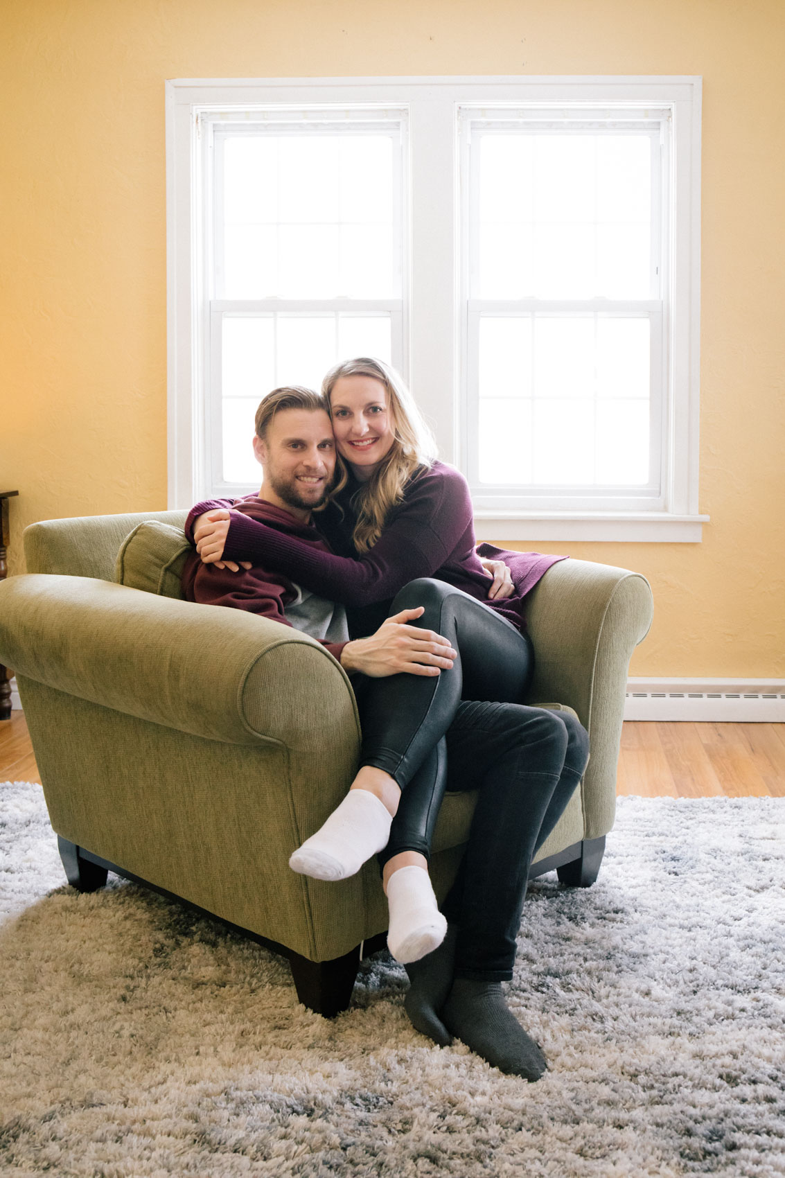 lifestyle blogger Allyn Lewis with husband, Shaun Novak, in the living room of their new home.