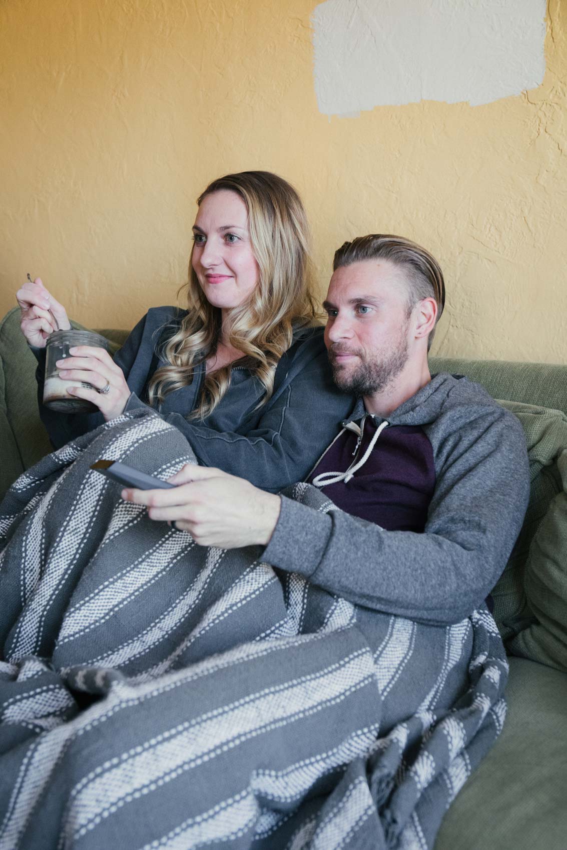 Allyn Lewis and Shaun Novak watching movies with Xfinity on Demand