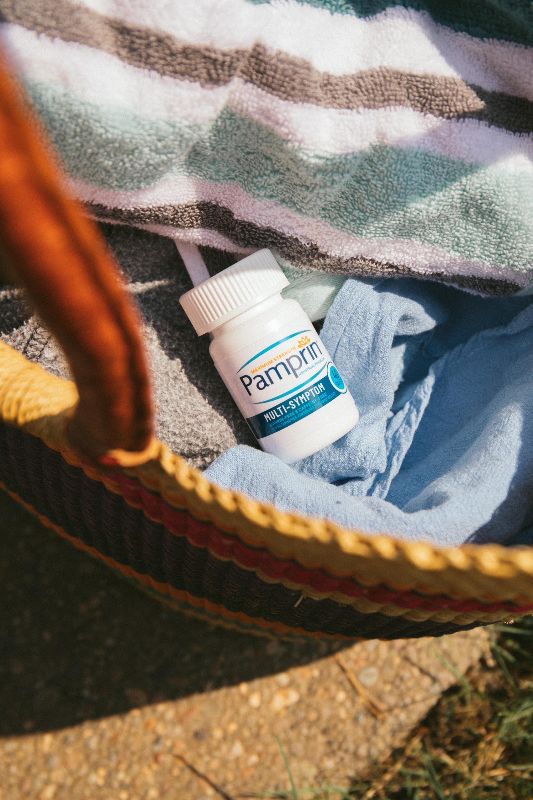 Pamprin Multi-Sympton period relief in a beach bag
